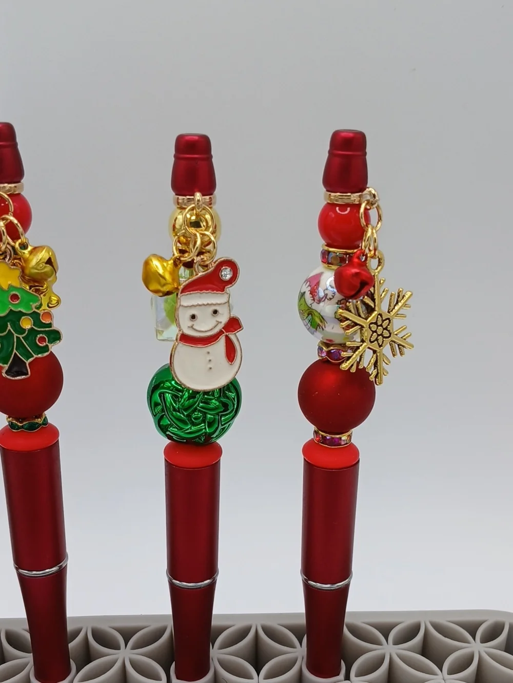 Festive Red Charm Pen with Holiday Decorations